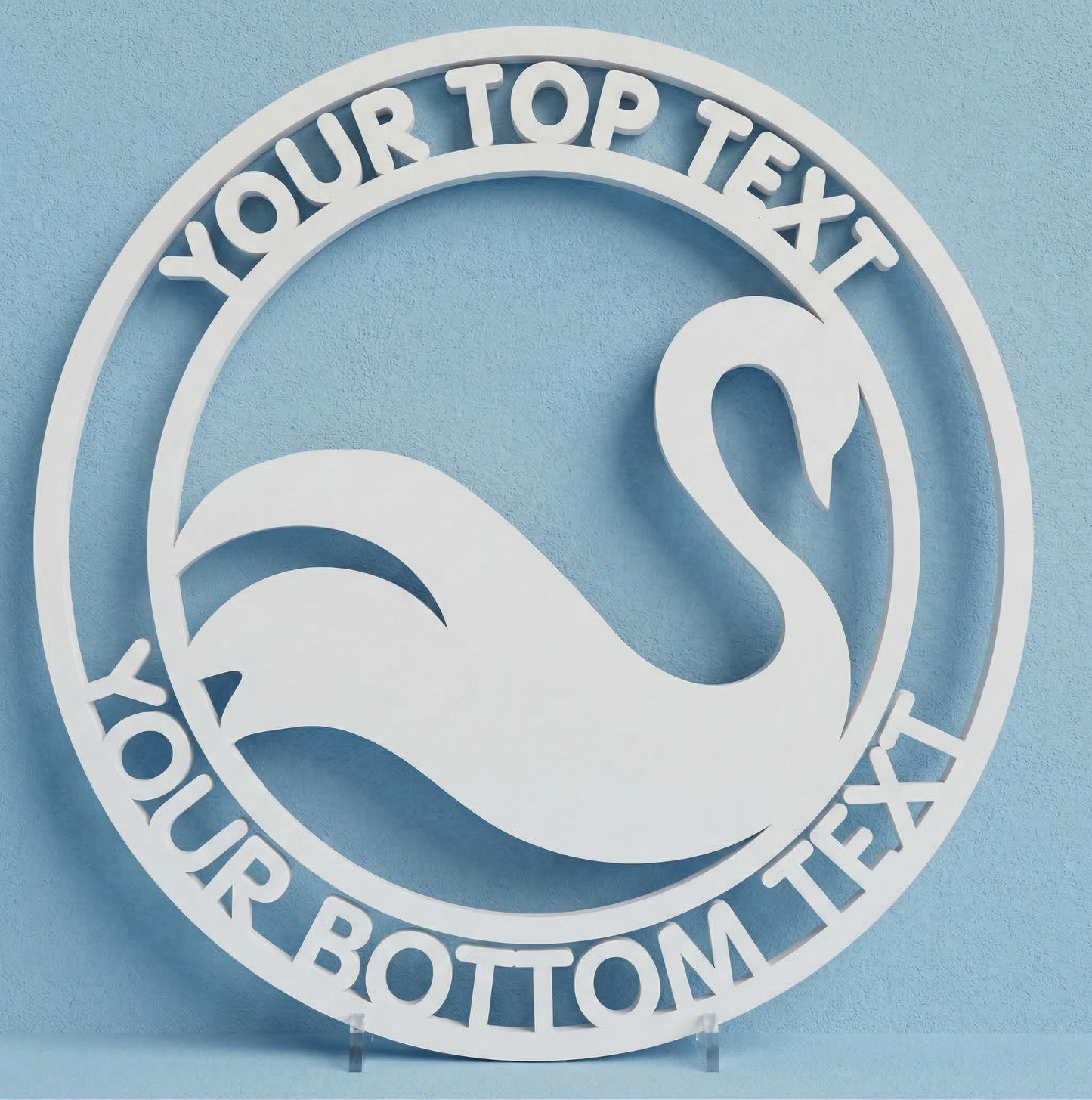 Decorative wall art with a swan design and customizable text on a blue background