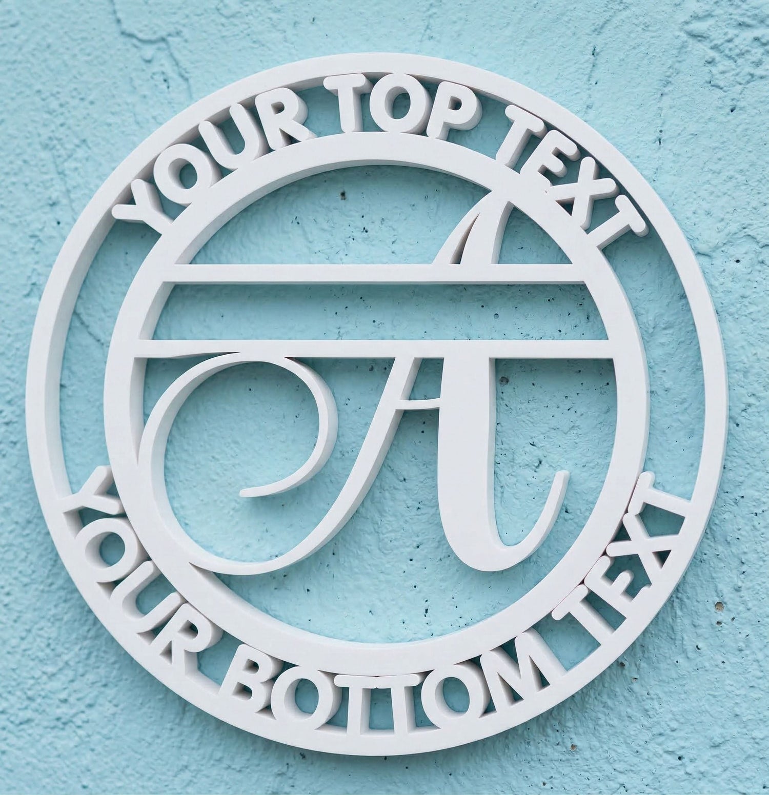 Decorative white PVC wall art with the letter "A" and customizable text on a light blue background