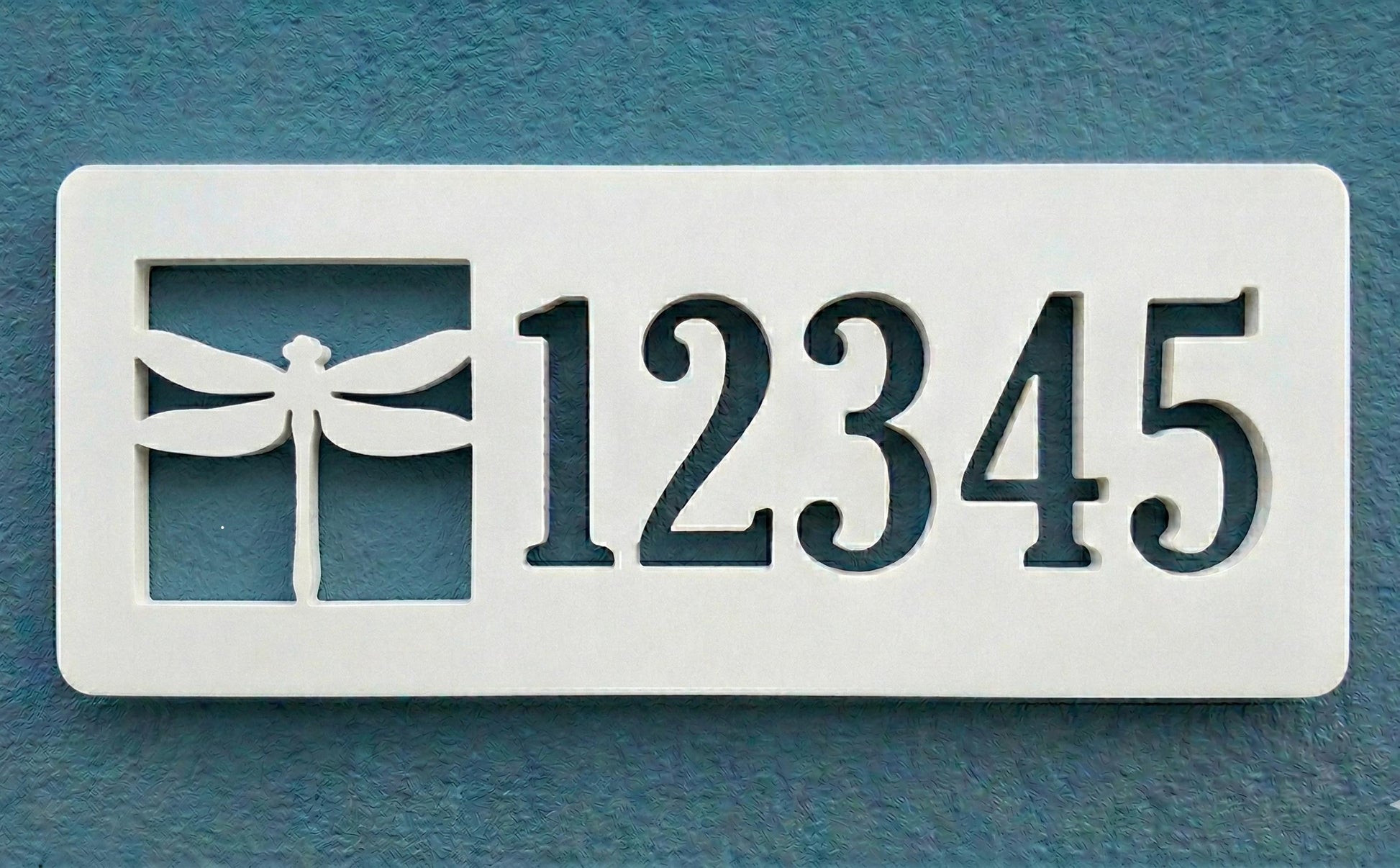 Rectangular PVC white house number sign with '12345' and a dragonfly design on a blue background