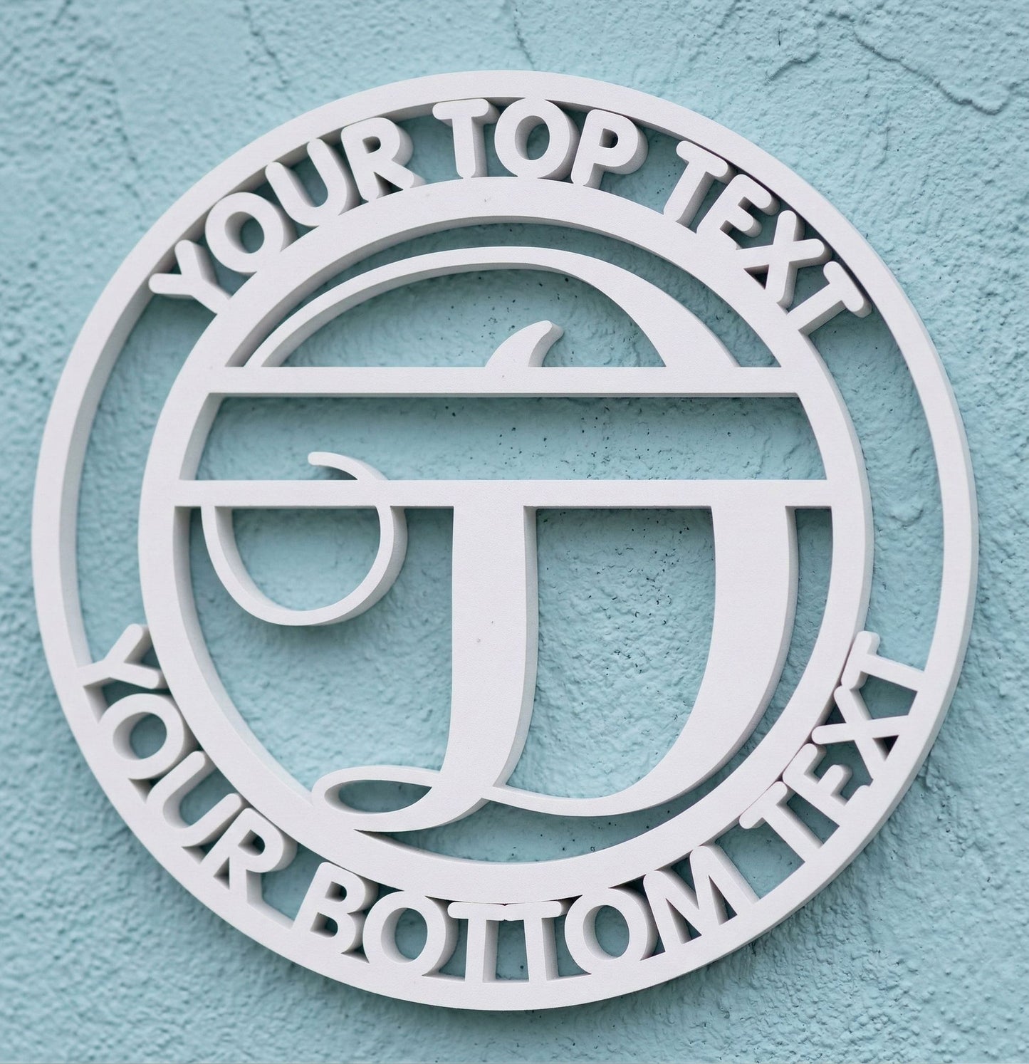 Decorative white PVC wall art with the letter "D" and customizable text on a light blue background