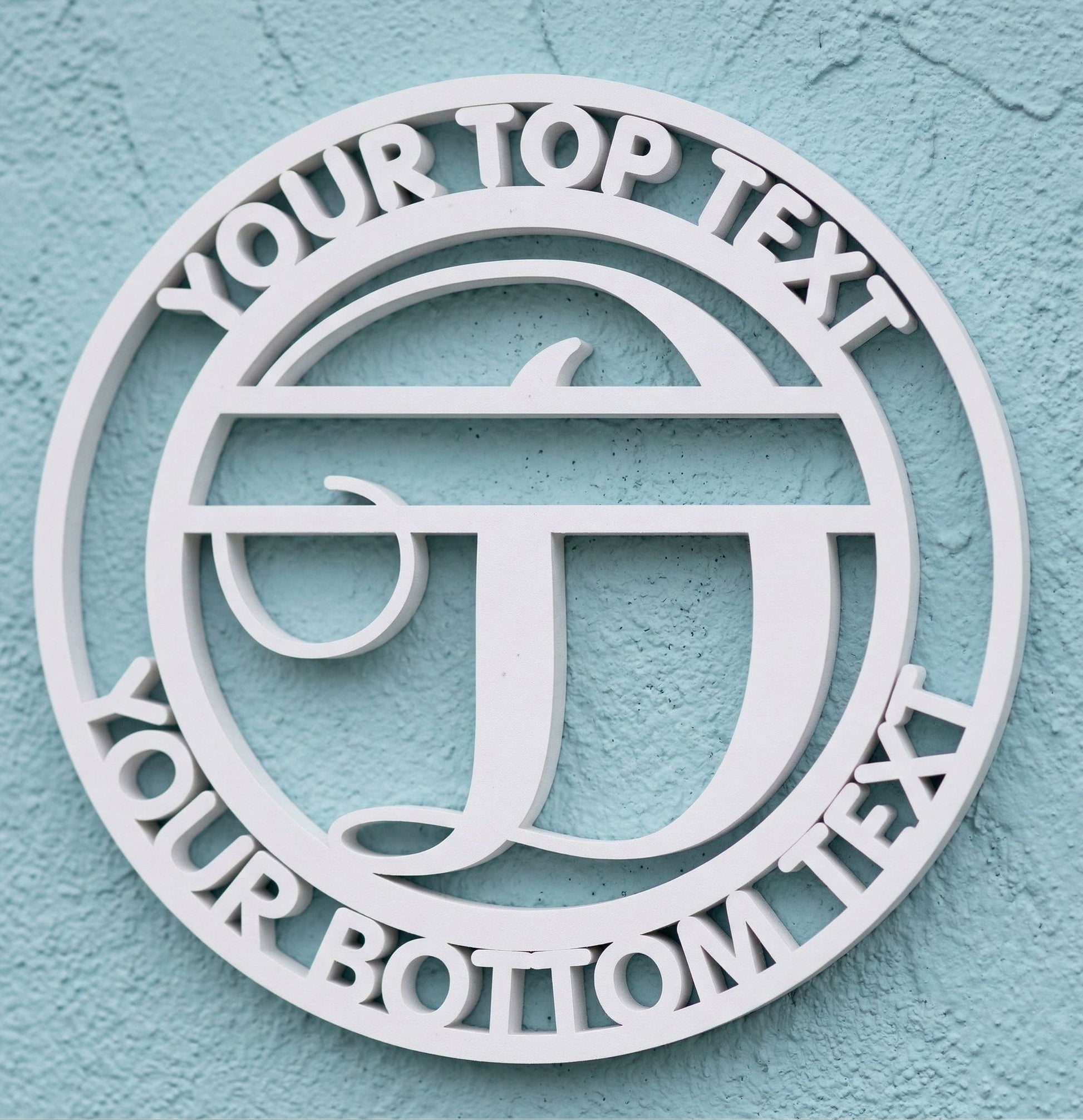 Decorative white PVC wall art with the letter "D" and customizable text on a light blue background
