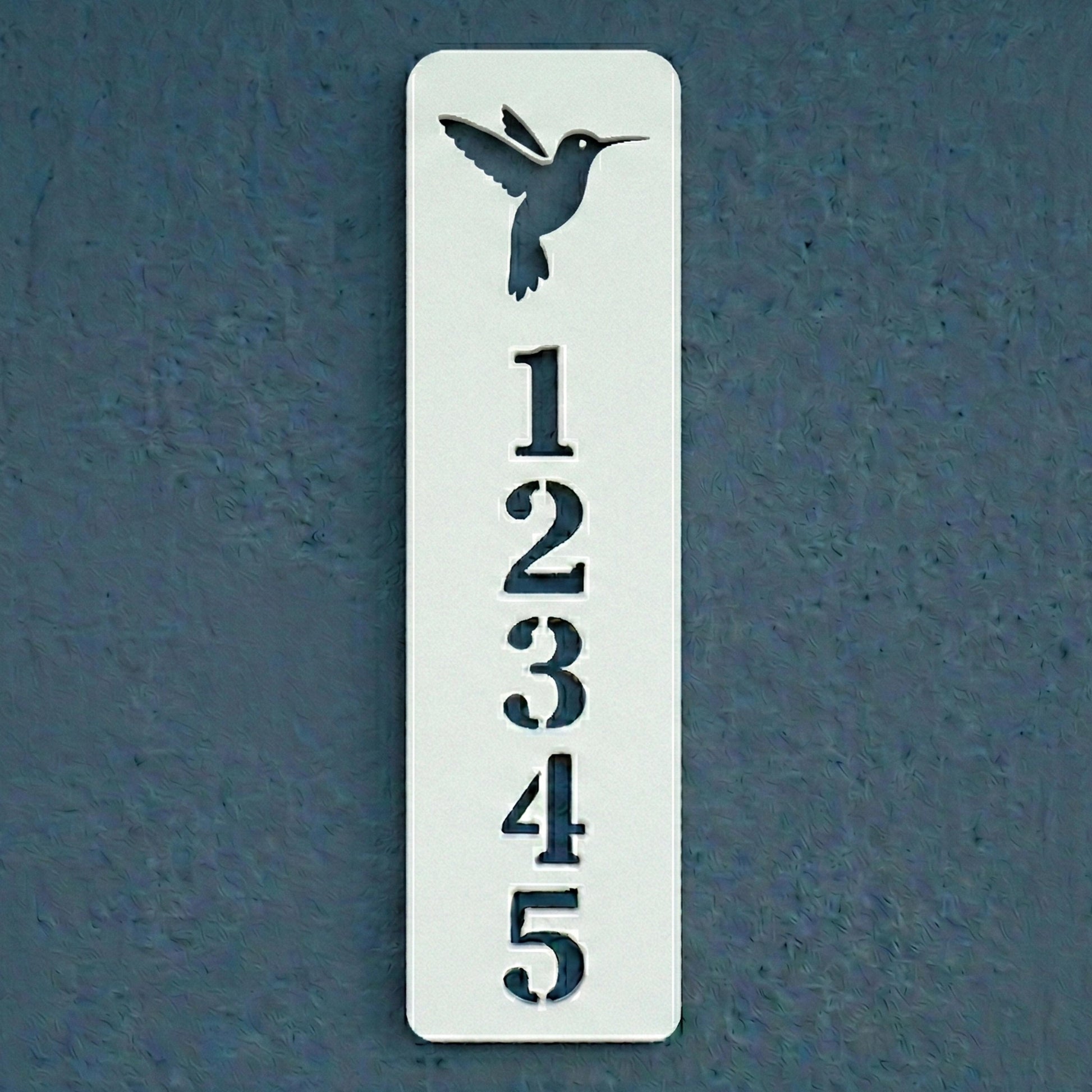 Decorative house number sign with a hummingbird design on a blue background