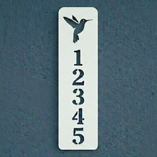 Decorative house number sign with a hummingbird design on a blue background